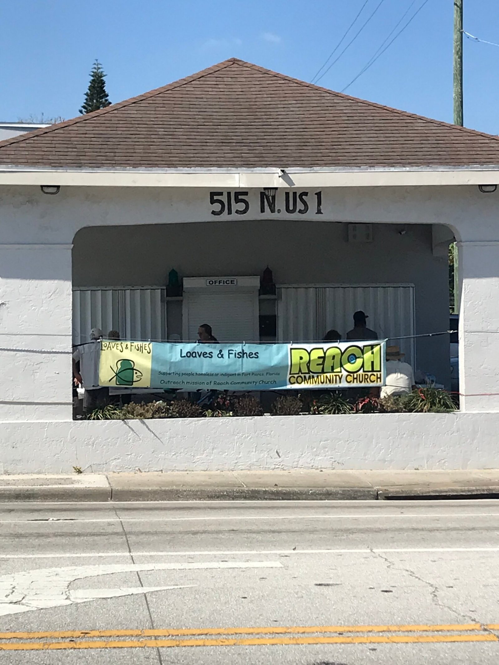Picture of the building front for 5 Star Automotive with the Loaves and Fishes banner shown